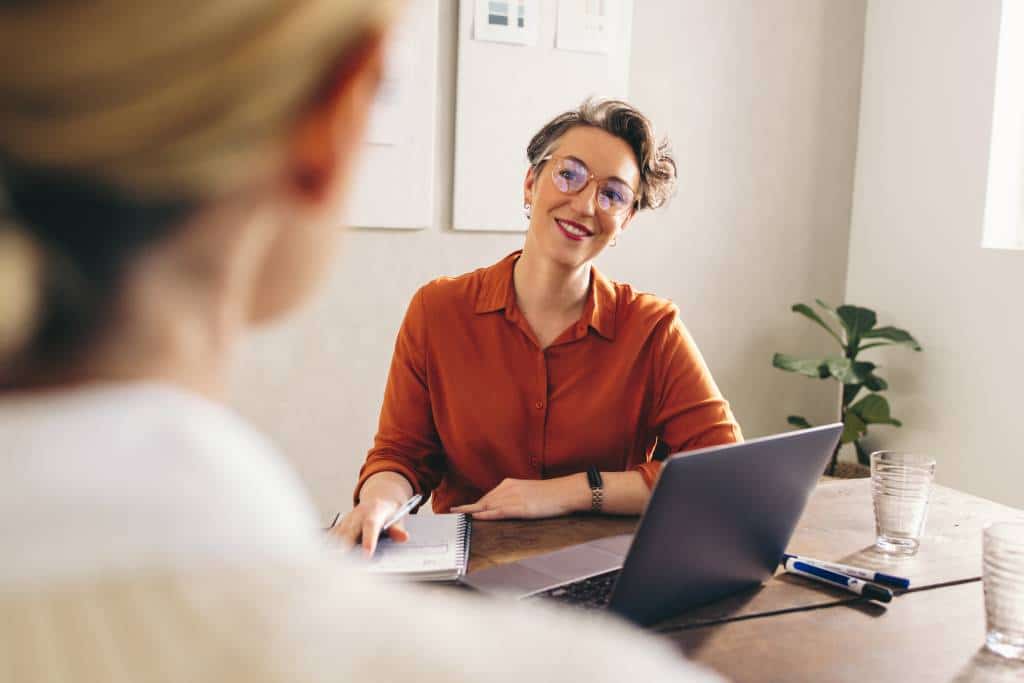 Happy hiring manager smiling at candidate