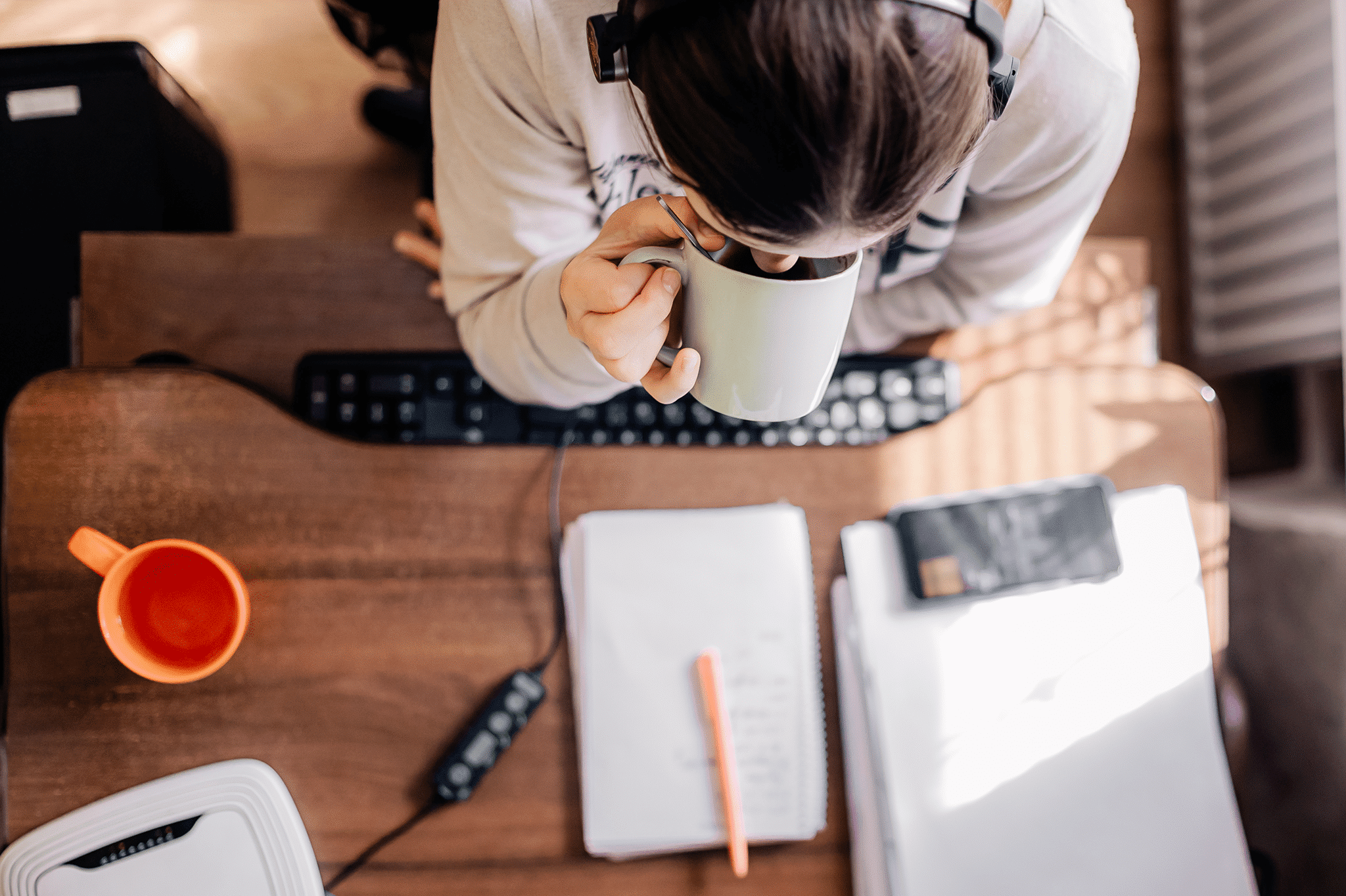 A freelancer working remotely in the gig economy with a strong sense of isolation from the company.